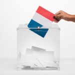 Le vrai Président de la France person-putting-france-flag-card-into-ballot-box (1)