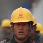 Canva-Group-of-Persons-Wearing-Yellow-Safety-Helmet-during-Daytime